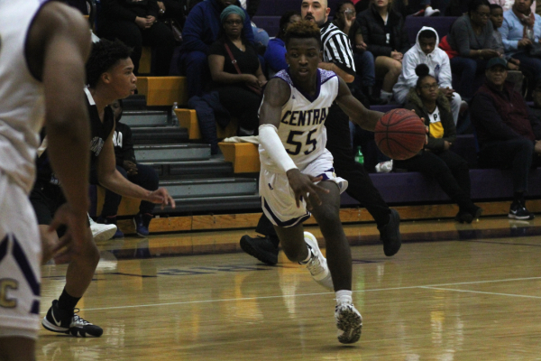 2020-21 BOYS BASKETBALL SEASON SET TO START -- Senior Kenneth Steward dribbles down the court looking for a pass during a game last season.