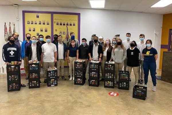 JROTC STUDENTS FACE POSTPONED ASVAB -- Central JROTC Members with the canned goods collected from the JROTC Annual Food Drive