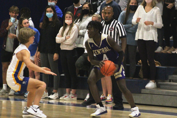 CENTRAL BOYS BASKETBALL LOSES IN GAMES AGAINST HIXSON, BOYD BUCHANAN, AND MCCALLIE -- Senior Garrnett Hubbard dribbles down the court looking for an open pass. 