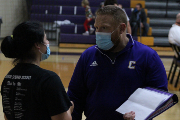 GABRIELLA GRAY MAKES HISTORY -- Sophomore Gabriella Gray talks to Coach Ryan Mallory for a strategy to win her match. 