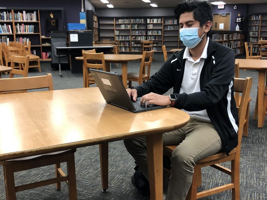 TOO MUCH SITTING -- Student completes work in Centrals Library. 