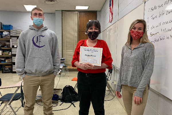 PEGGY MOYER IS CENTRAL'S TEACHER OF THE MONTH FOR MARCH -- Peggy Moyer is presented with her teacher of the month certificate by Luke Keown and Amber Burchfield. 