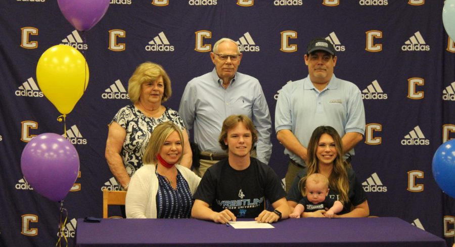 ROBY+THOMAS+SIGNS+TO+WRESTLE+AT+KAISER+UNIVERSITY+--+Roby+Thomas+pictured+with+family+during+his+Signing+Party+ceremony.+