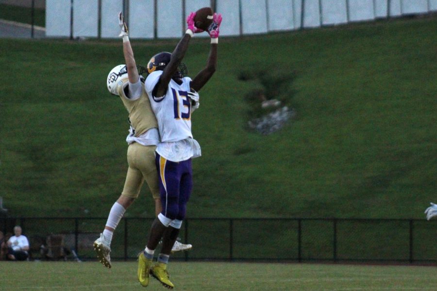 FOOTBALL: POUNDERS RUN OVER SODDY DAISY IN 18-7 DISTRICT VICTORY -- Junior, Donovan Smith goes up for a catch. 