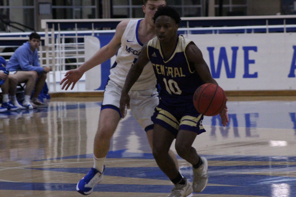 A LOOK INTO THE 2021-2022 BOYS BASKETBALL SEASON -- Senior Noah Collins plays in one of the seasons first games.