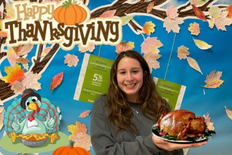 CARMS CORNER: HAPPY THANKSGIVING! -- Carmen Breitenbach standing with Thanksgiving turkey.