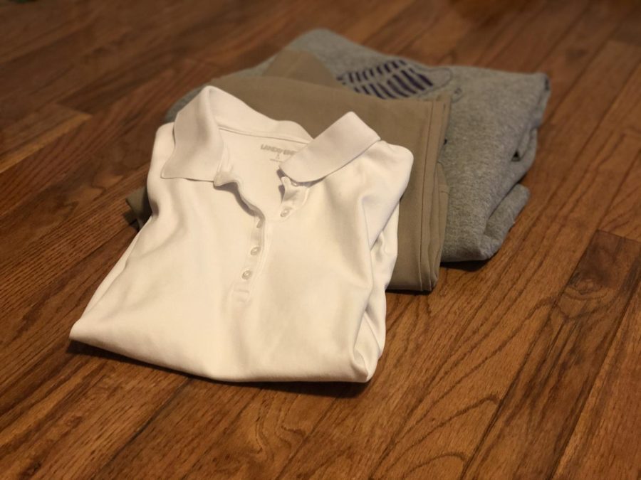 NEW DRESS CODE ENFORCEMENT POLICY PROMPTS VARYING RESPONSES FROM TEACHERS AND STUDENTS -- The Central dress code consists of khaki pants, grade level colored polo, and school colored and approved outerwear.