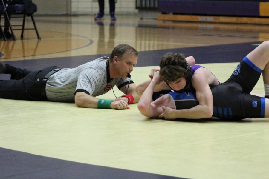 CENTRALS+GIRLS+WRESTLING+TEAM+OFF+TO+AN+IMPRESSIVE+START%3B+COACHES+WANT+IMPROVEMENT+FROM+BOYS+--+Junior+wrestler%2C+Cameron+Hook+faces+his+opponent+on+the+mat.
