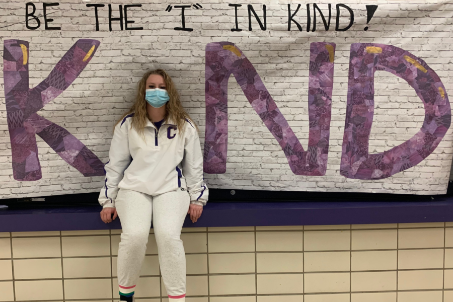CENTRAL CELEBRATES KINDNESS WEEK -- Freshman, Emma Lakin poses at the Be the I in kind poster in the cafeteria. 