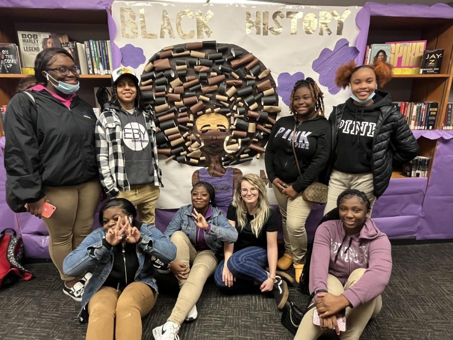 POSITIVITY CLUB PROMOTES AFRICAN-AMERICAN HERITAGE WITH COLORFUL DISPLAY IN THE LIBRARY -- Members who worked on the African-American History month display in the library pictured from left to right. Top row: Kayla Parks, Leighana James, Amari Ervin, and TaNey Green. Bottom Row: Tatiana Iceland, DaMarrie Byrd, Mrs. Broussard, and Ashari Roberson. 
