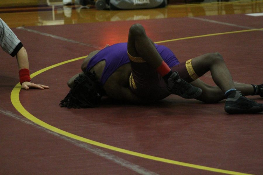 WRESTLING 2021-2022 SEASON GALLERY -- Freshman, Marquis Parson  pins his opponent for a win.