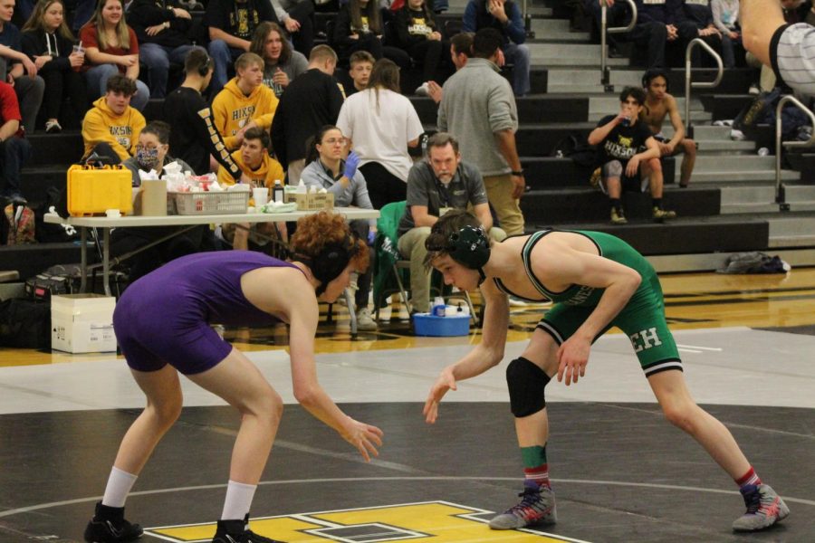 WRESTLING 2021-2022 SEASON GALLERY -- Freshman, Caleb Smith stares at his opponent watching for an opportunity to move.
