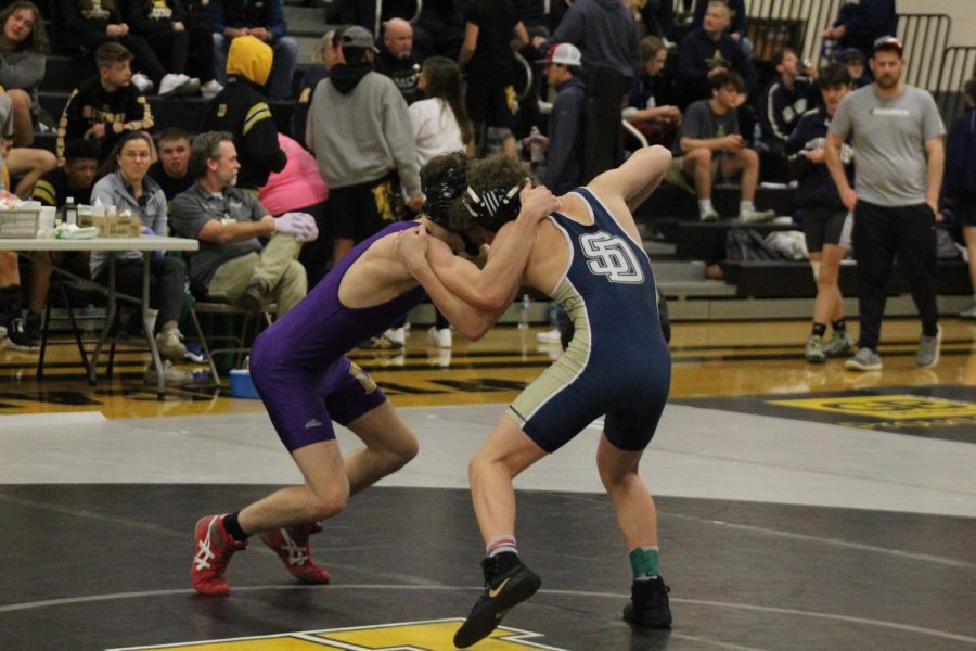 WRESTLING 2021-2022 SEASON GALLERY -- Junior, Cameron Hook welcomes the opportunity to take his opponent down to the mat.