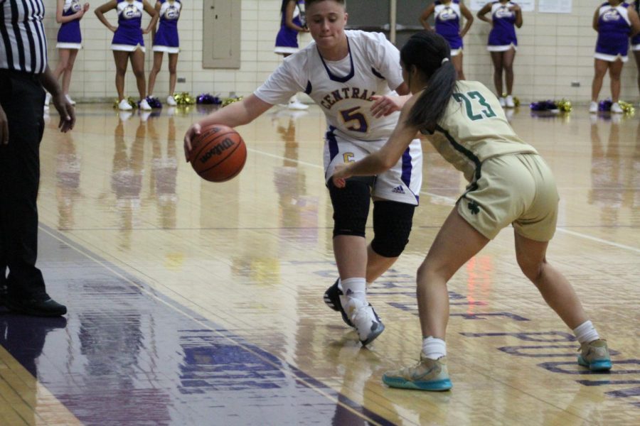 GIRLS BASKETBALL 2021-2022 SEASON GALLERY- Sophomore Hadien Harness blocking the ball from Notre Dame player.