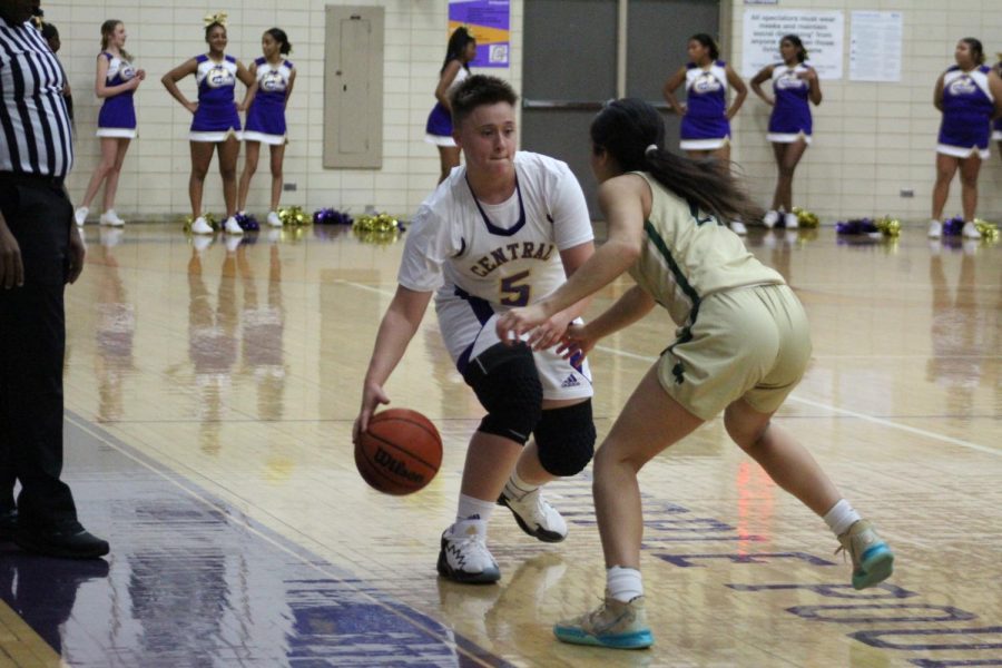 GIRLS BASKETBALL 2021-2022 SEASON GALLERY- Sophomore Haiden Harness blocking ball from Notre Dame player. 