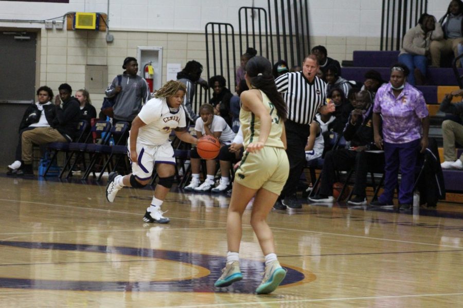GIRLS BASKETBALL 2021-2022 SEASON GALLERY- Junior Janaye Parker dribbling the ball down the court to the Notre Dame goal.