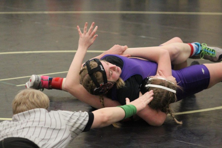 WRESTLING 2021-2022 SEASON GALLERY -- Sophomore, Nevaeh LaFevor pins her opponent at The State Tournament.
