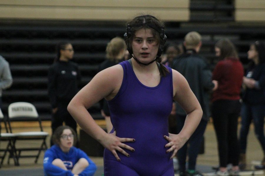 WRESTLING 2021-2022 SEASON GALLERY -- Junior, Gabby Gray stands waiting to face her opponent.