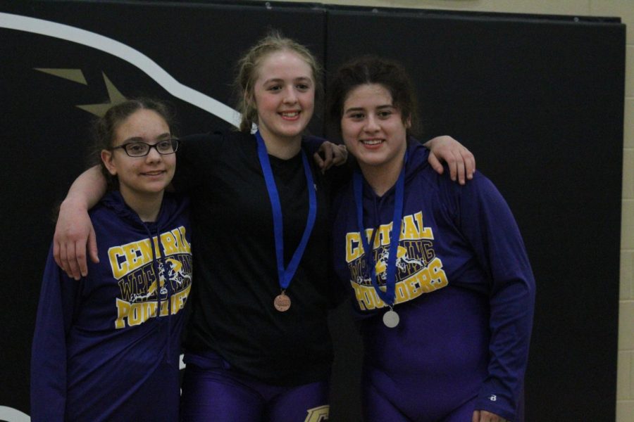 WRESTLING 2021-2022 SEASON GALLERY -- The Girls Wrestling Team at the Region Tournament. The two state qualifiers Nevaeh LaFevor and Gabby Gray with their medals.