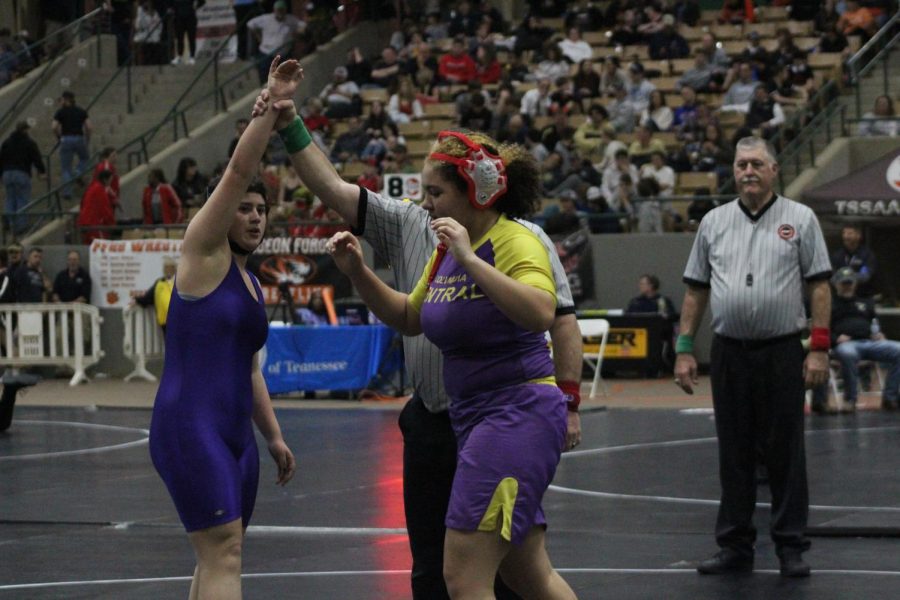 WRESTLING 2021-2022 SEASON GALLERY -- Junior, Gabby Gray has her hand raised as she wins her match at state.
