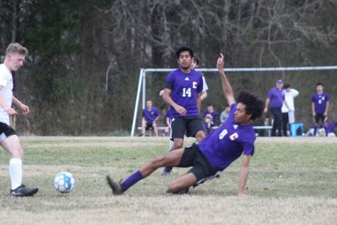 GETTING HIS KICKS -- Junior Tyson Dean steals the ball way from a Sequatchie Indian in a recent match.