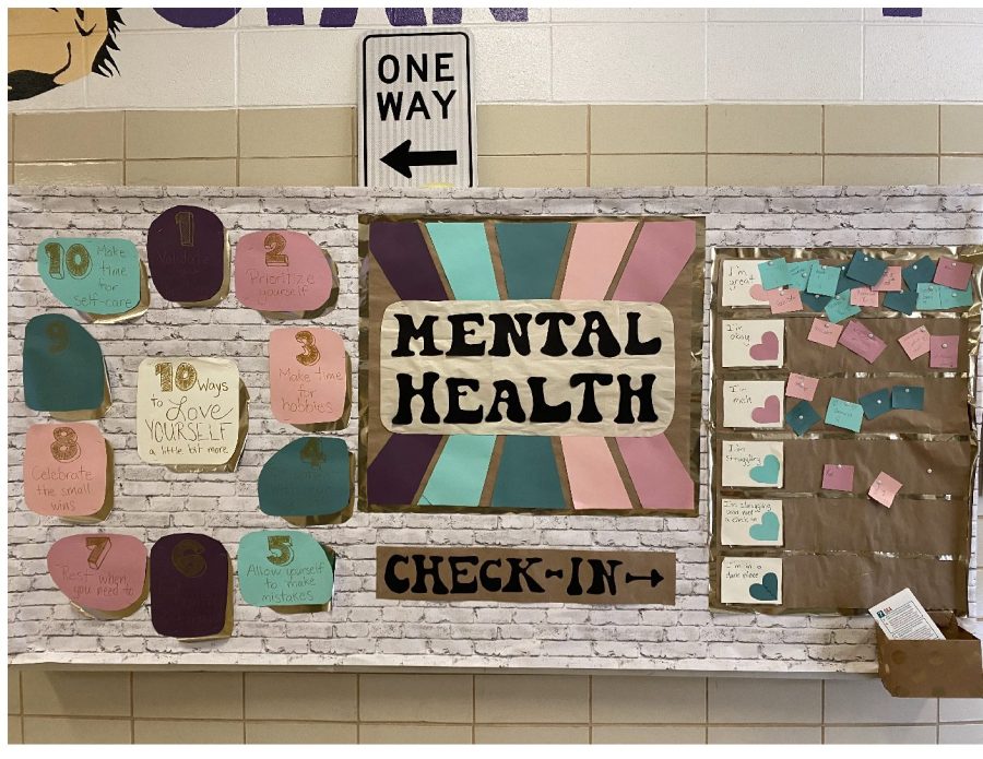 DO STUDENTS NEED MENTAL HEALTH DAYS?-- This Mental Health Check in, located outside of C-Pod, was created by the Positivity Club led by Mrs. Broussard. 