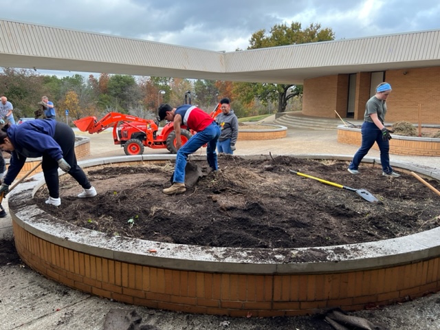 THE FILM AND RURITEEN CLUB CONDUCT A CAMPUS BEAUTIFICATION PROJECT- Pictured above are students and volunteers planting new trees to help beautify the front of Central High School. 