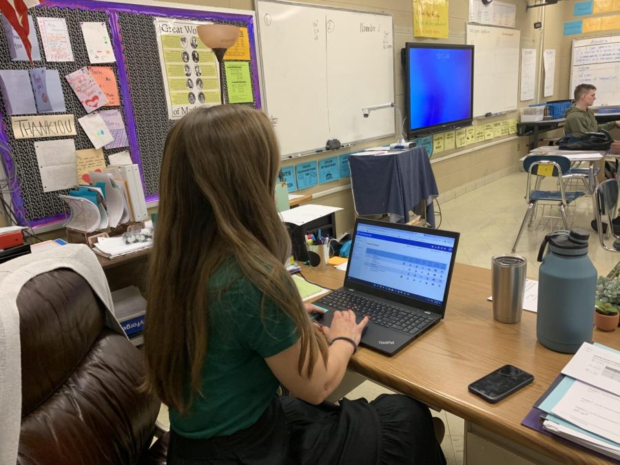 TENNESSEE MANDATES NEW-MANDATORY 10-POINT GRADING SCALE FOR ALL SCHOOLS -- Mrs. Mcgrath grading work in class with the new applied grading scale.